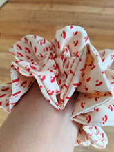 Load image into Gallery viewer, scrunchie close up on the wrist