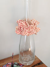 Load image into Gallery viewer, scrunchie display on the bottle