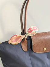 Load image into Gallery viewer, ribbon hair tie on a bag