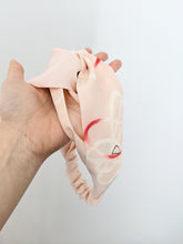 Load image into Gallery viewer, pink headband held by hand
