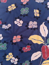 Load image into Gallery viewer, navy blue wall art with colourful flowers close up
