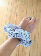 Load image into Gallery viewer, purple and dot scrunchie on wrist
