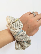 Load image into Gallery viewer, gray scrunchie on wrist
