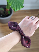 Load image into Gallery viewer, bow hair tie on wrist
