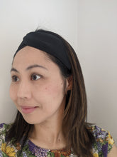 Load image into Gallery viewer, woman wearing a black silk turban style headband
